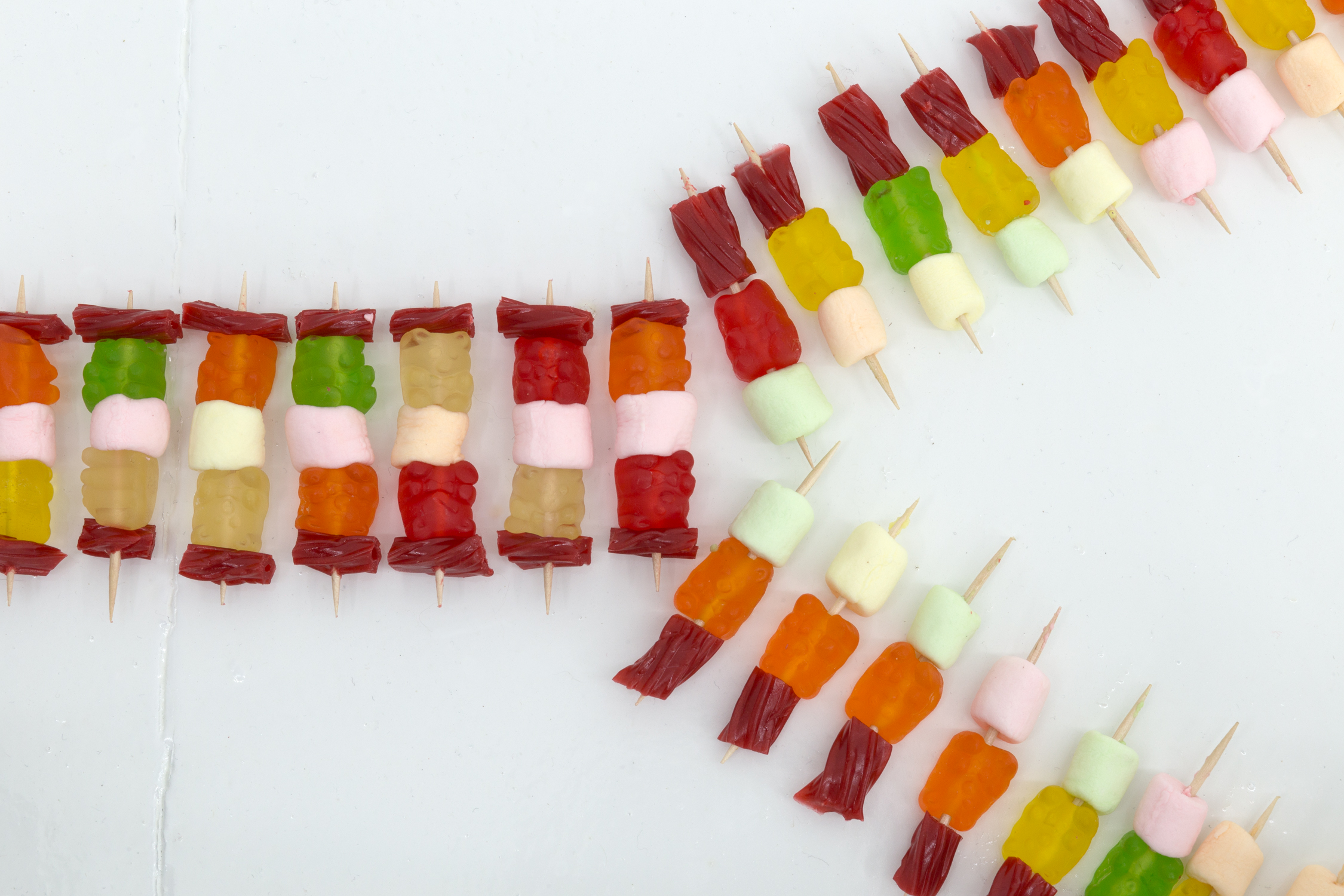 Close up of floor sculpture made of multi-colored candy and toothpicks