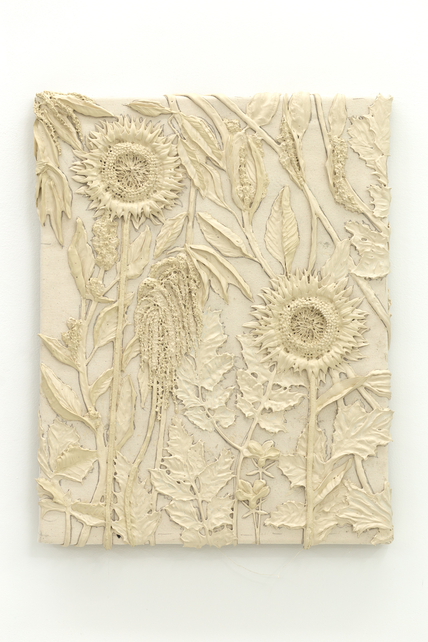 Tan monotone plastic painting of two sunflowers and assorted other plants
