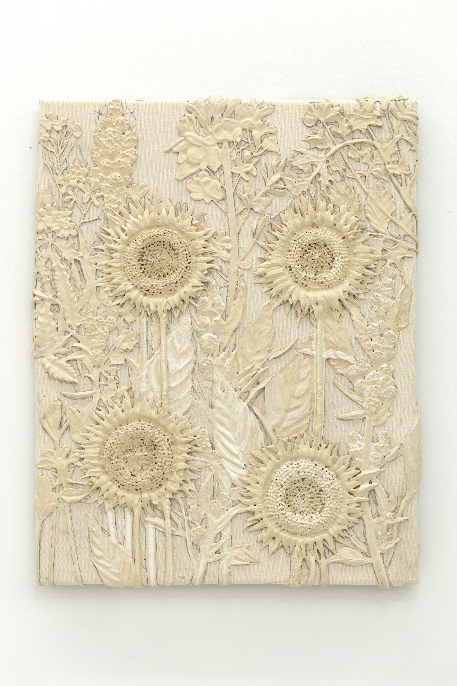 Tan monotone plastic painting of three sunflowers and assorted other plants