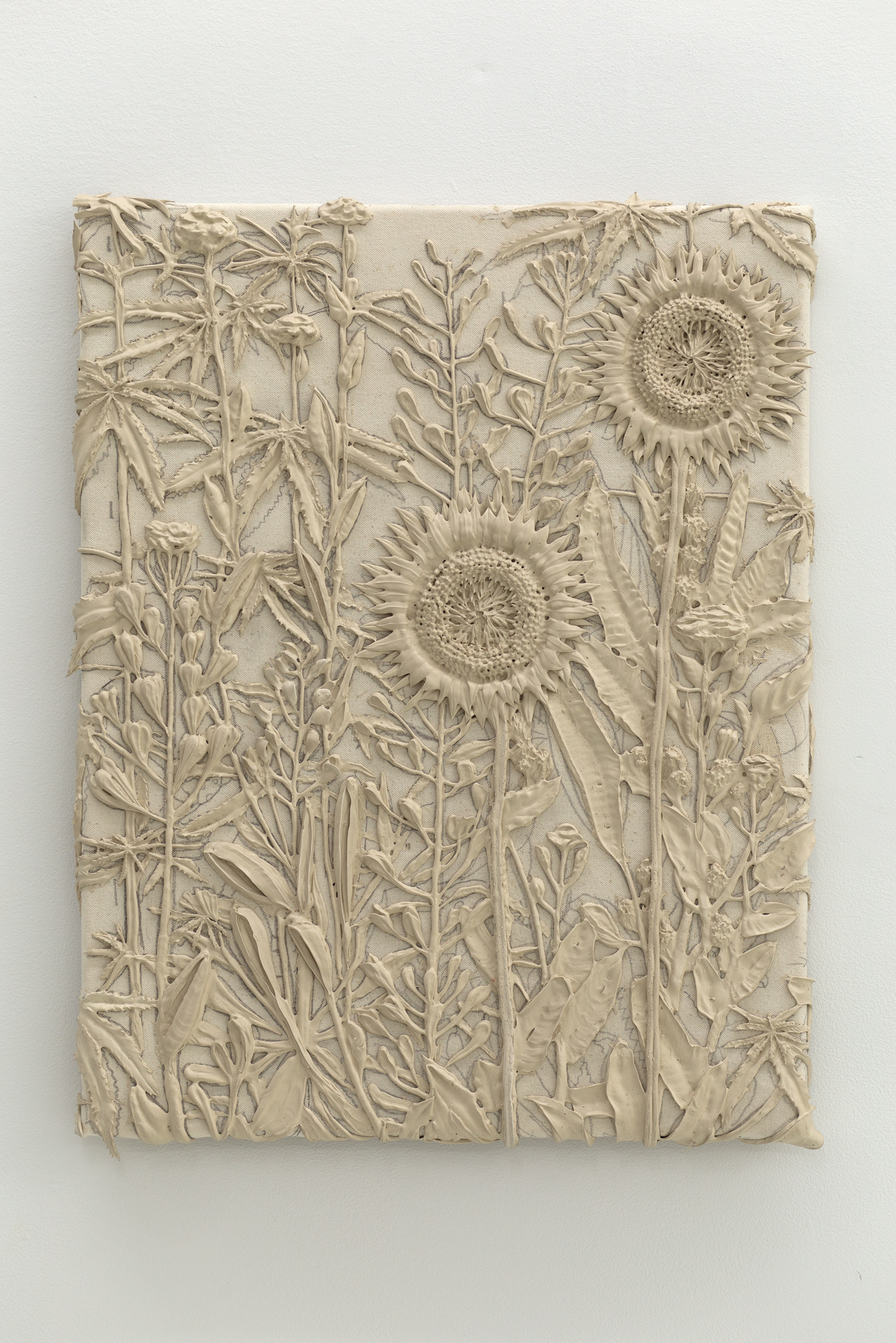 Tan monotone plastic painting of two sunflowers and assorted other plants